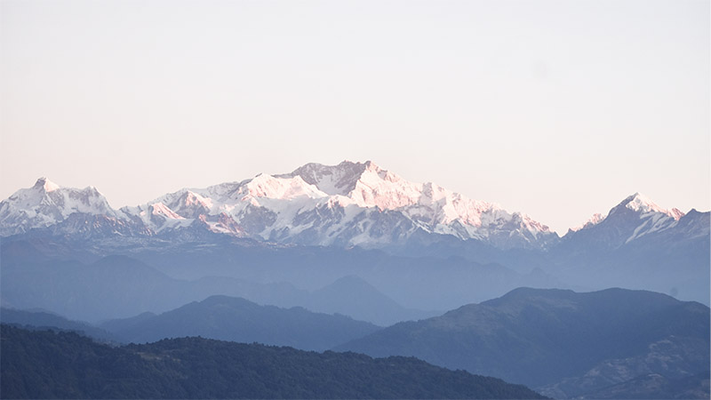 Mountain landscape symbolizing Apollo’s decarbonization journey, representing private equity-driven value creation, real assets strategy, and ESG-focused capital solutions across portfolio companies.
